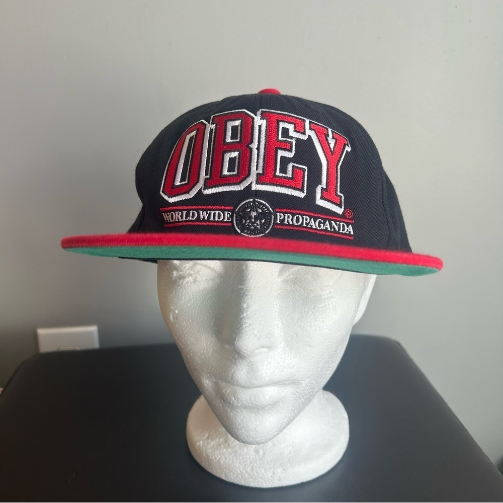 Obey “Worldwide Propaganda” Black & Red Flat Brim Snap Back Baseball Cap